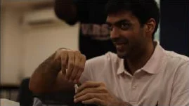 Participant smiling while assembling